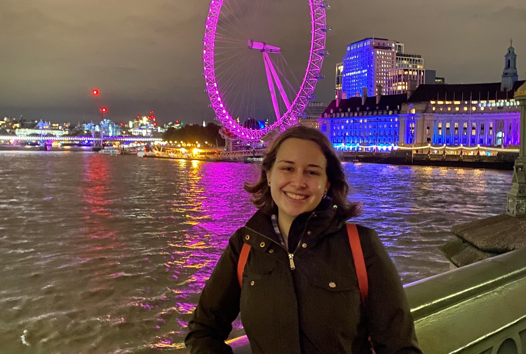 Julia Benton '22 poses on the South Bank in London with the Millennium Wheel in the background. 