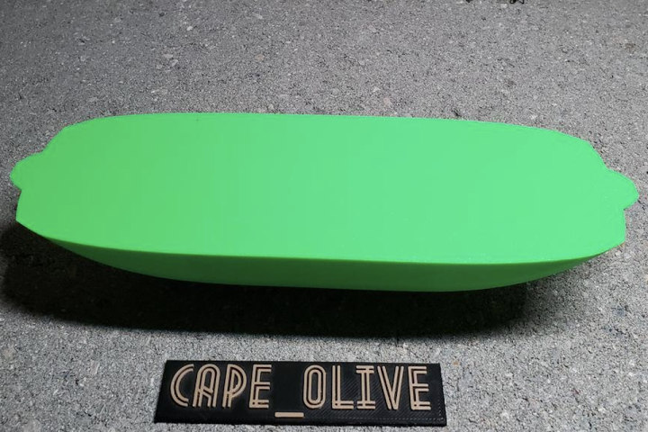 A 3D Printed boat made by the Quantitative Engineering Analysis (QEA) class in the Fall 2020 semester. A green, oval-shaped, 3D printed boat with the words "Cape_Olive" printed underneath it.