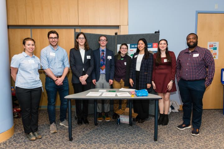 Moderna SCOPE Team 2024 Summit Students posing in front of project poster with liaison