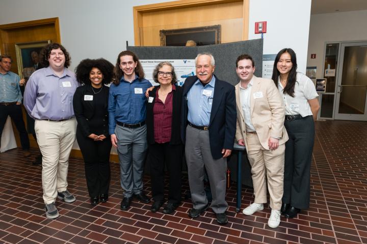 Santos Volpe Team 2024 Summit Students posing in front of project poster with sponsors