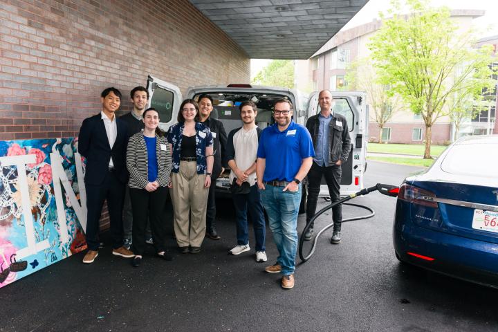 SparkChargeTeam2024Summit Students posing in front of project with liaison