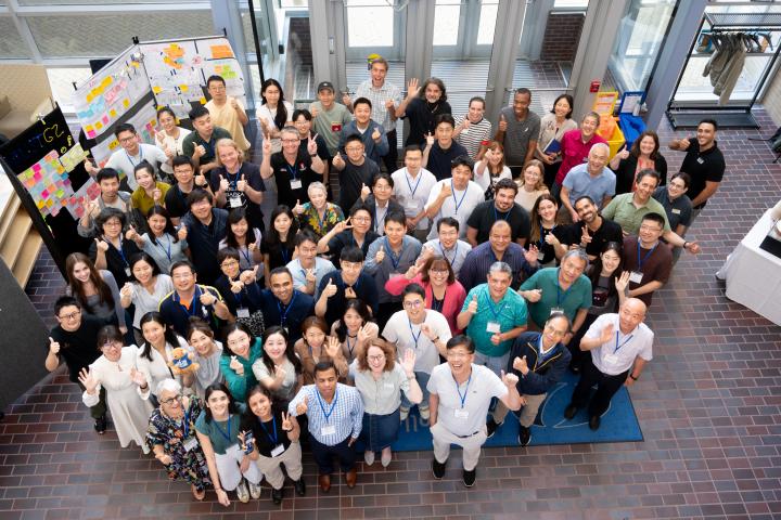 Summer Studio 2024 Group Shot Overhead photo of all summer studio participants giving a thumbs up