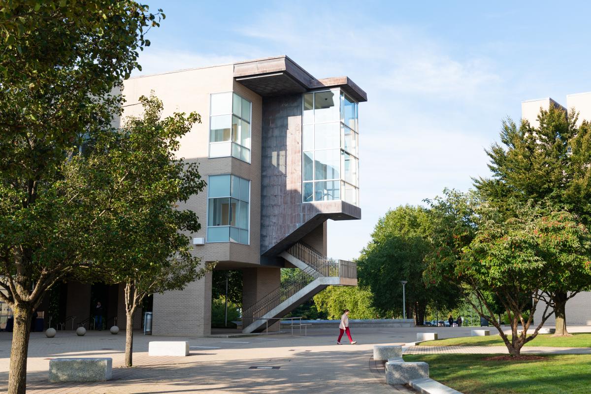 The Milas Hall Building at Olin College of Engineering A photo of a three story building surrounded by trees