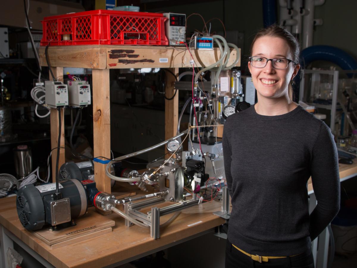 Desalination research at Olin College of Engineering A photo of professor Emily Tow standing with her desalination system
