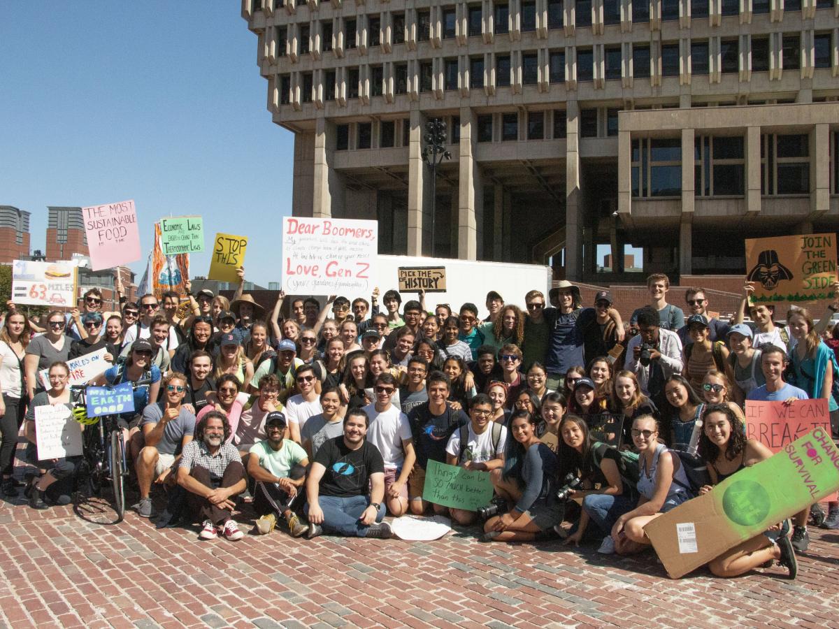 Members of the Olin Community Participate in the 2019 Global Climate Strike in Boston, MA. A large group of people gather and hold signs at a climate protest in Boston, MA.
