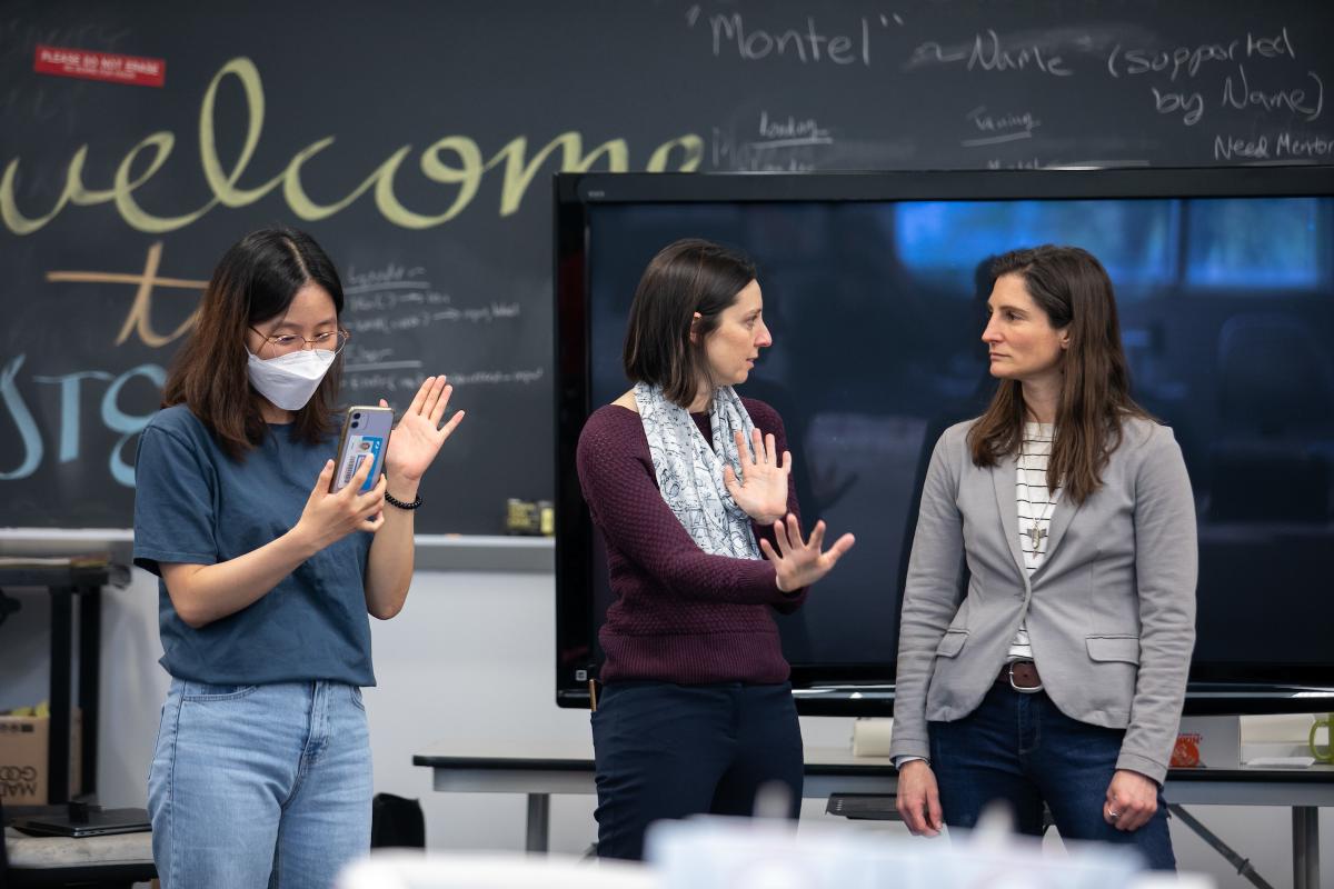Three members of the Olin College STEP Course talk in a classroom. Three members of the Olin College STEP Course talk in a classroom.