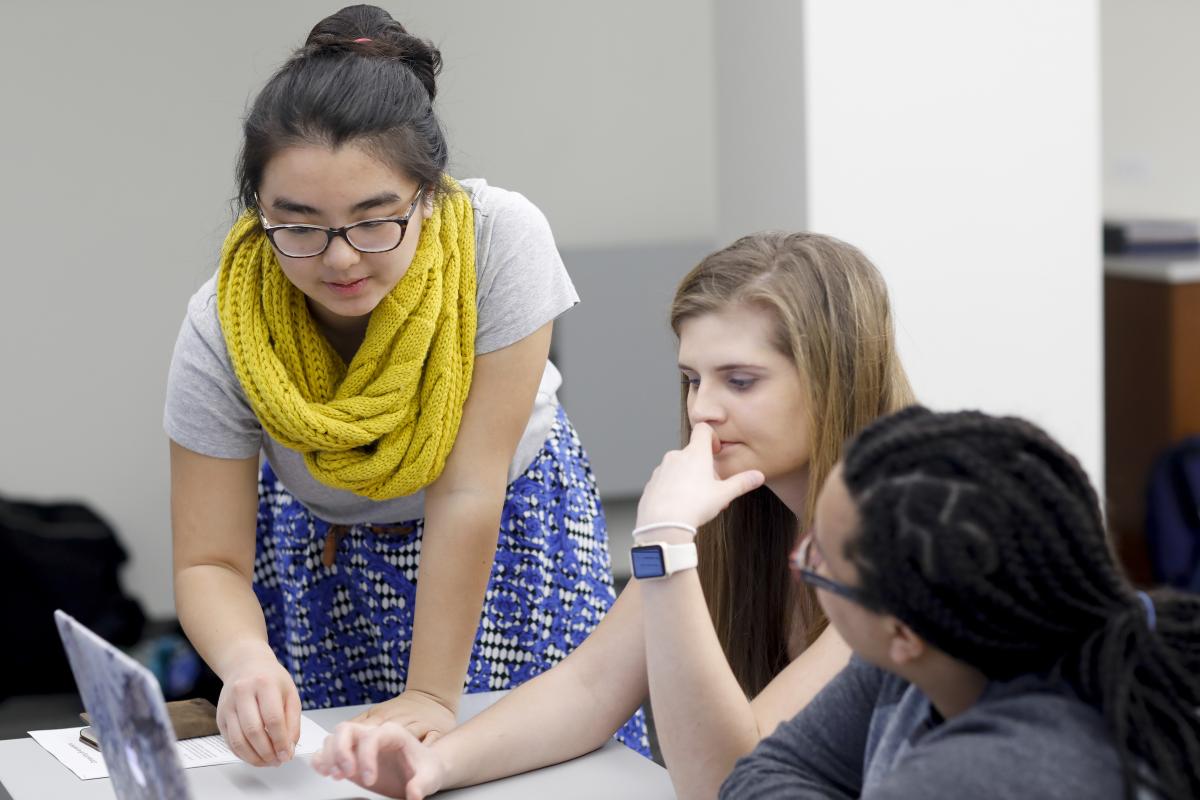 Emily discusses Arduino code with students while teaching a Computing Everywhere workshop at Northwestern University (Spring 2017). 