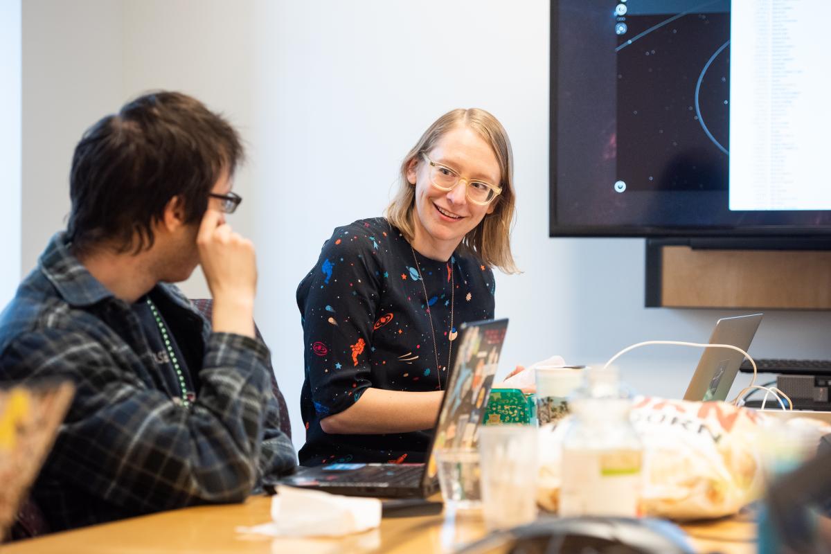 Carrie working with students in her lab