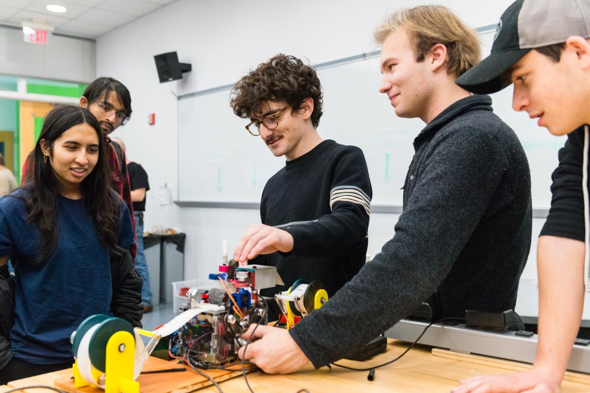 The PIE Turing machine team demo their build to fellow students The PIE Turing machine team demo their build to fellow students