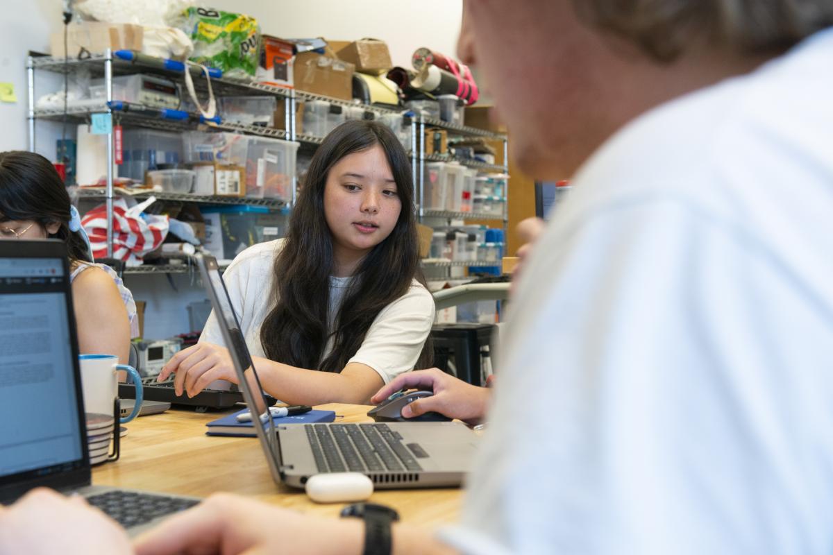 An Olin student looks at a laptop in a classroom. An Olin student looks at a laptop in a classroom.