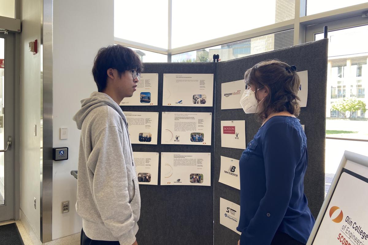 A student and Lauren Palmer ’09 speak at the SCOPE Showcase. A student and Lauren Palmer ’09 speak at the SCOPE Showcase.