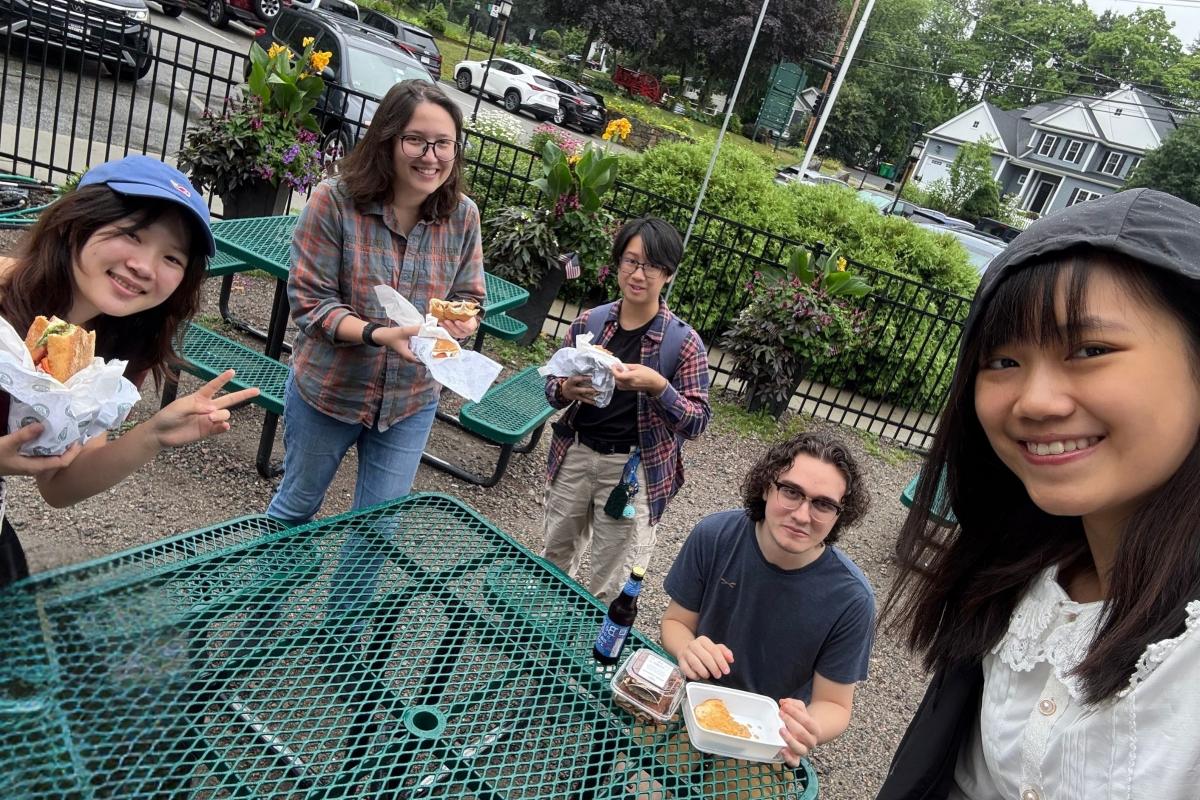 Members of the CREST Lab enjoy a bite to eat.