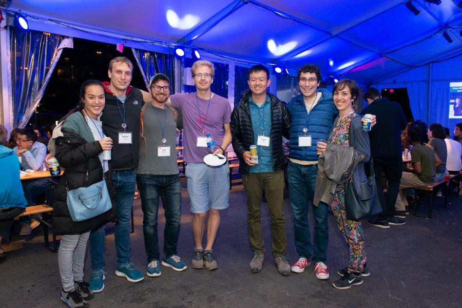 Scenes from Alumni Weekend 2021 at Olin College of Engineering A group of people standing arm in arm and smiling at the camera