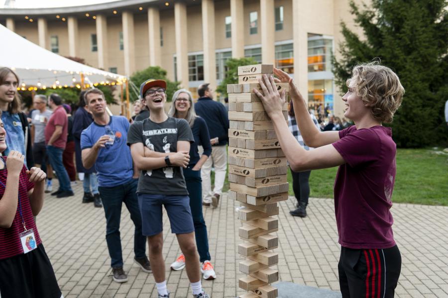 Families play giant jenga on the Oval.