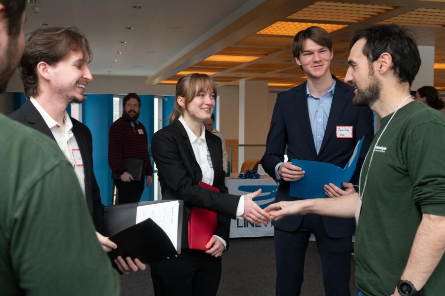 An Olin College student shakes hands with a prospective employer at the Fall 2025 Career Fair on Olin's Needham, MA campus.