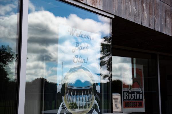 A photo of sign that reads "Welcome Back Olin"