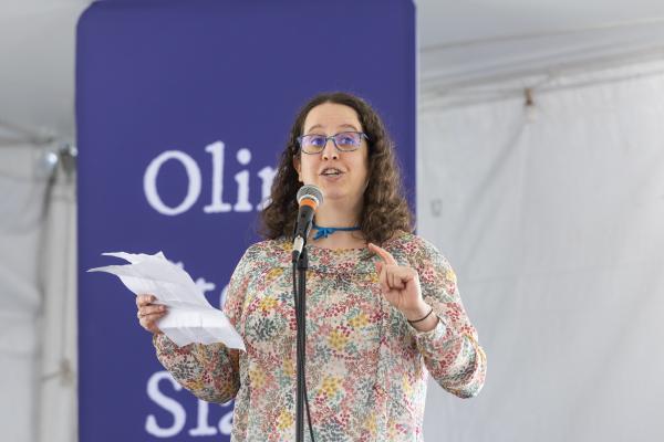 A staff member performs at Olin Story Slam.