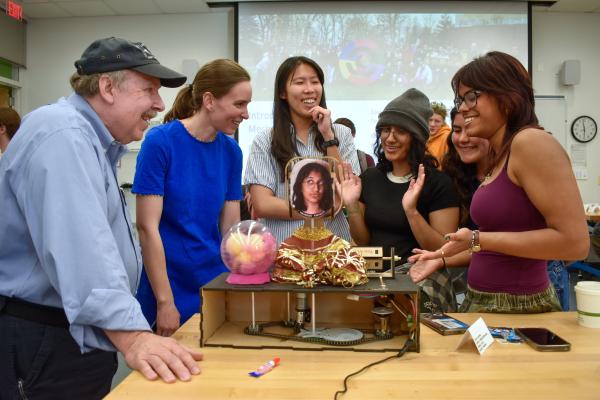Olin professors engage with students in MechProto in 2026.