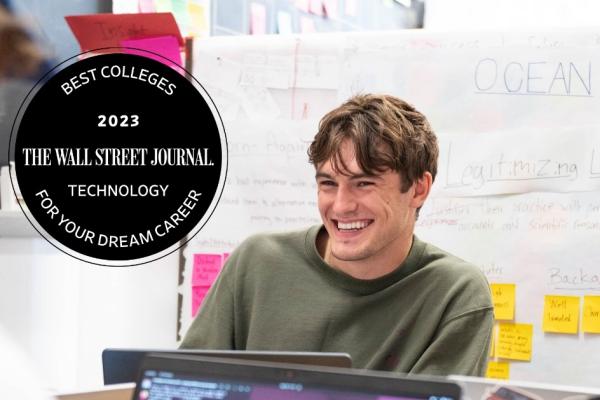 An Olin student is shown smiling in class. The image has a WSJ 2023 Best Colleges for Technology badge.