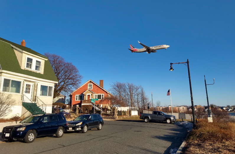 Air Quality - Picture of EJ community with plane flying over it