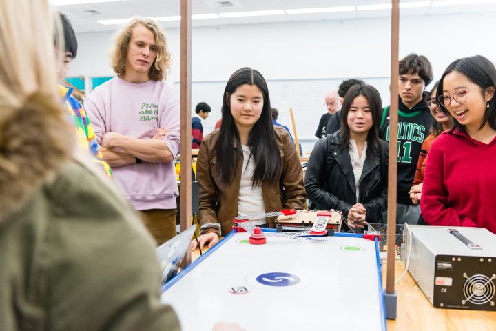 Students test out a classmate's project during a Principles of Integrated Engineering (PIE) Demo Day in 2023.