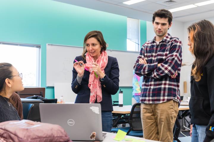 A photo of Professor Sam Michalka in the middle of a discussion with Olin Students