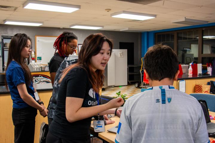 Members of Ideas Become Impact (IBI) are Pictured Leading a Workshop