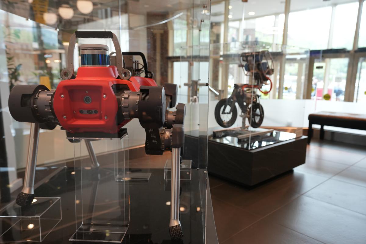 Two robots in glass cases.