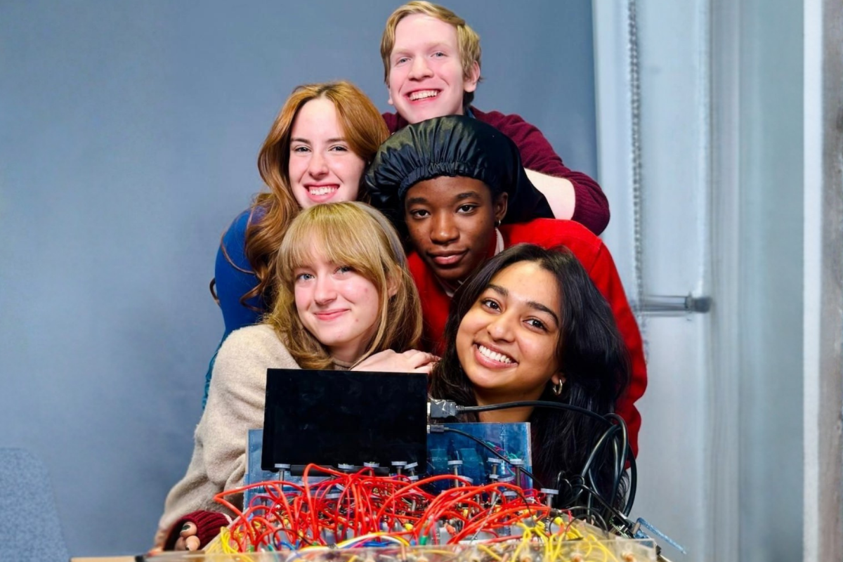 Five Olin College students pose with their final PIE Project