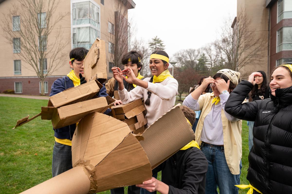 Olin College of Engineering students are seen using various cardboard cylinders and other materials during the MechProto Build Challenge in April, 2026.