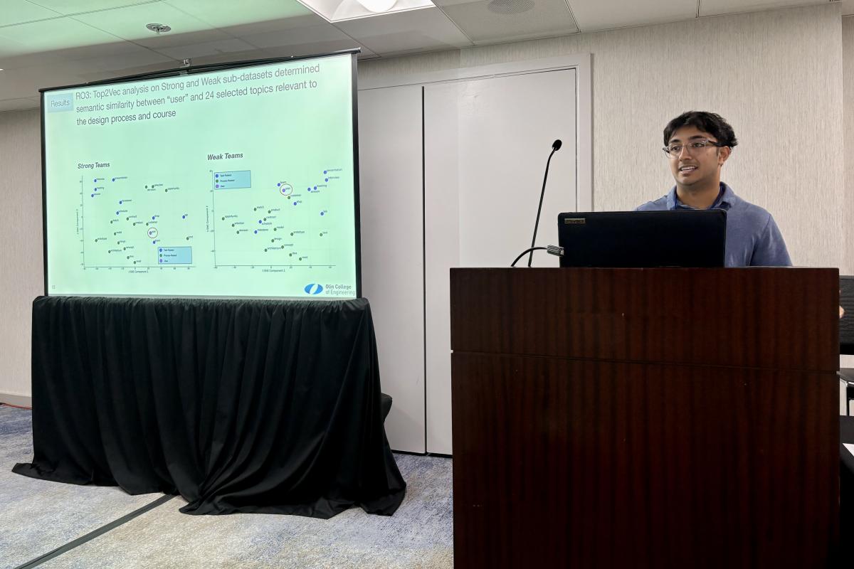 Photo of student presenting slide show