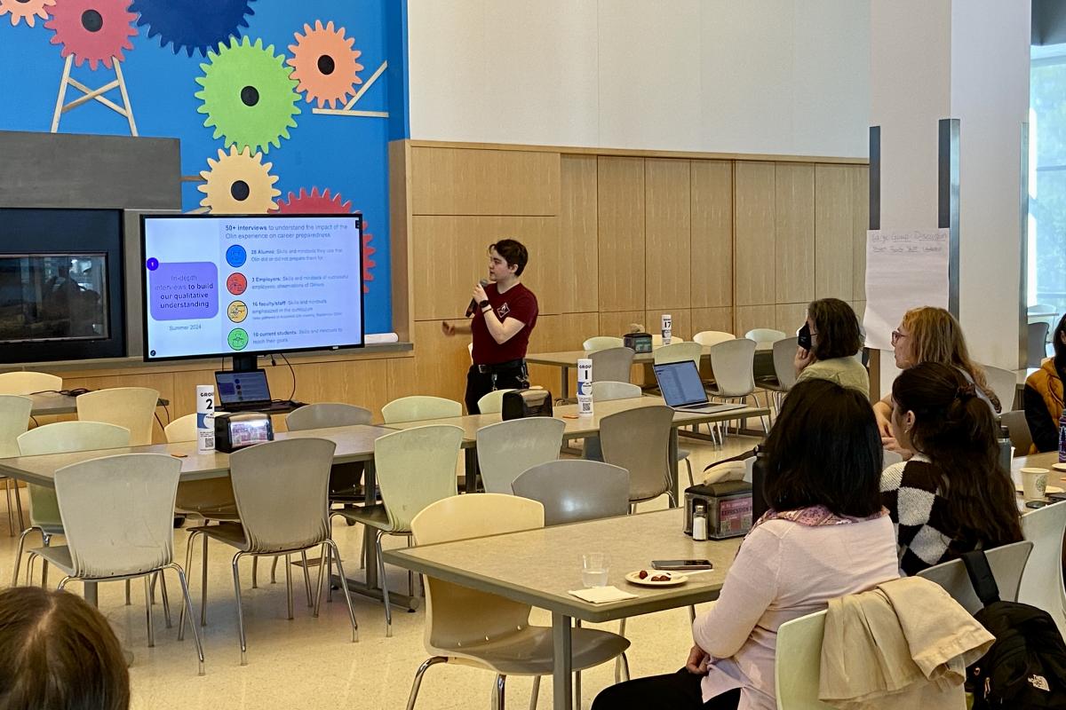 Student Presenting Slides on Research Project