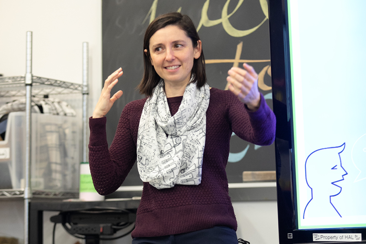 A Photo of Sam Michalka presenting