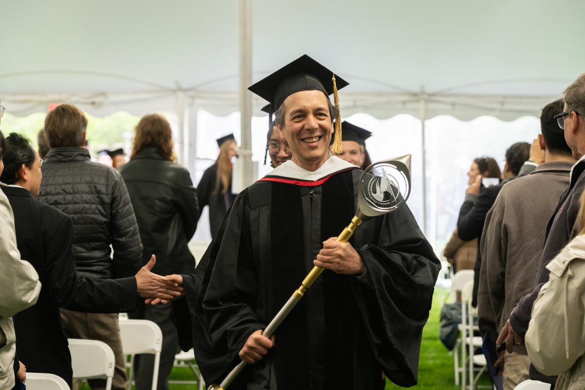 Chief Marshal Robert Martello, Interim Dean of Faculty Affairs and Professor of the History of Science & Technology leading the academic procession into the Great Lawn