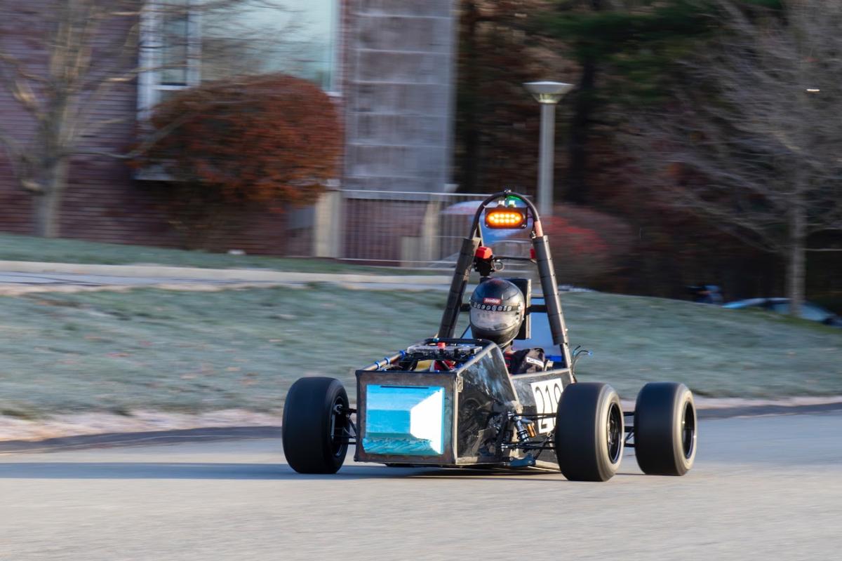 The Olin Electric Motorsports Team's electric car is seen on the road