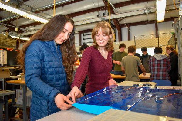 Olin AERO project team students work together on a build component.