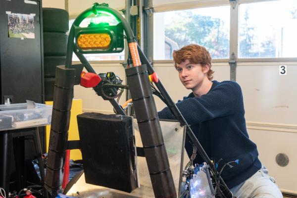 An Olin OEM member works on their vehicle. 