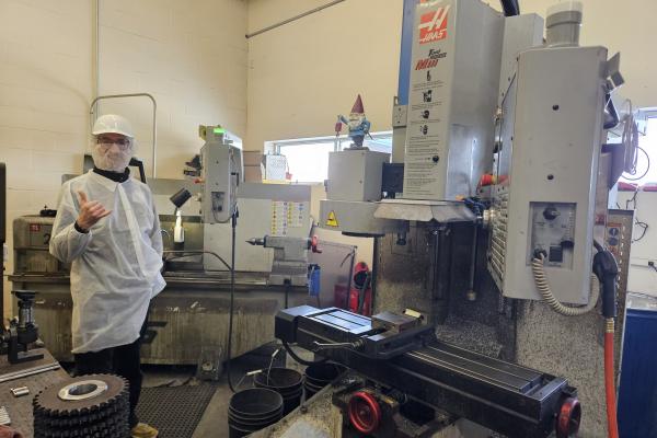 Coby Unger stands near one of the Barilla machines. 
