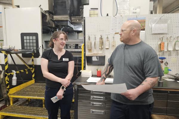 Lauren Palmer ’09 and an Instron staff member speaking together. 