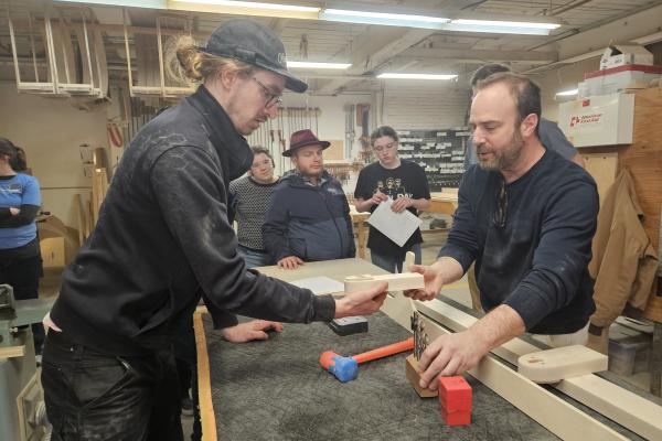 Coby Unger assists a staff member of O&G Studio. 