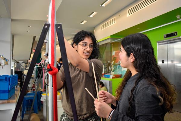 Two students work on their Build Challenge project. 