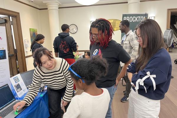 Members of IBI are Pictured Instructing a Student During a Workshop